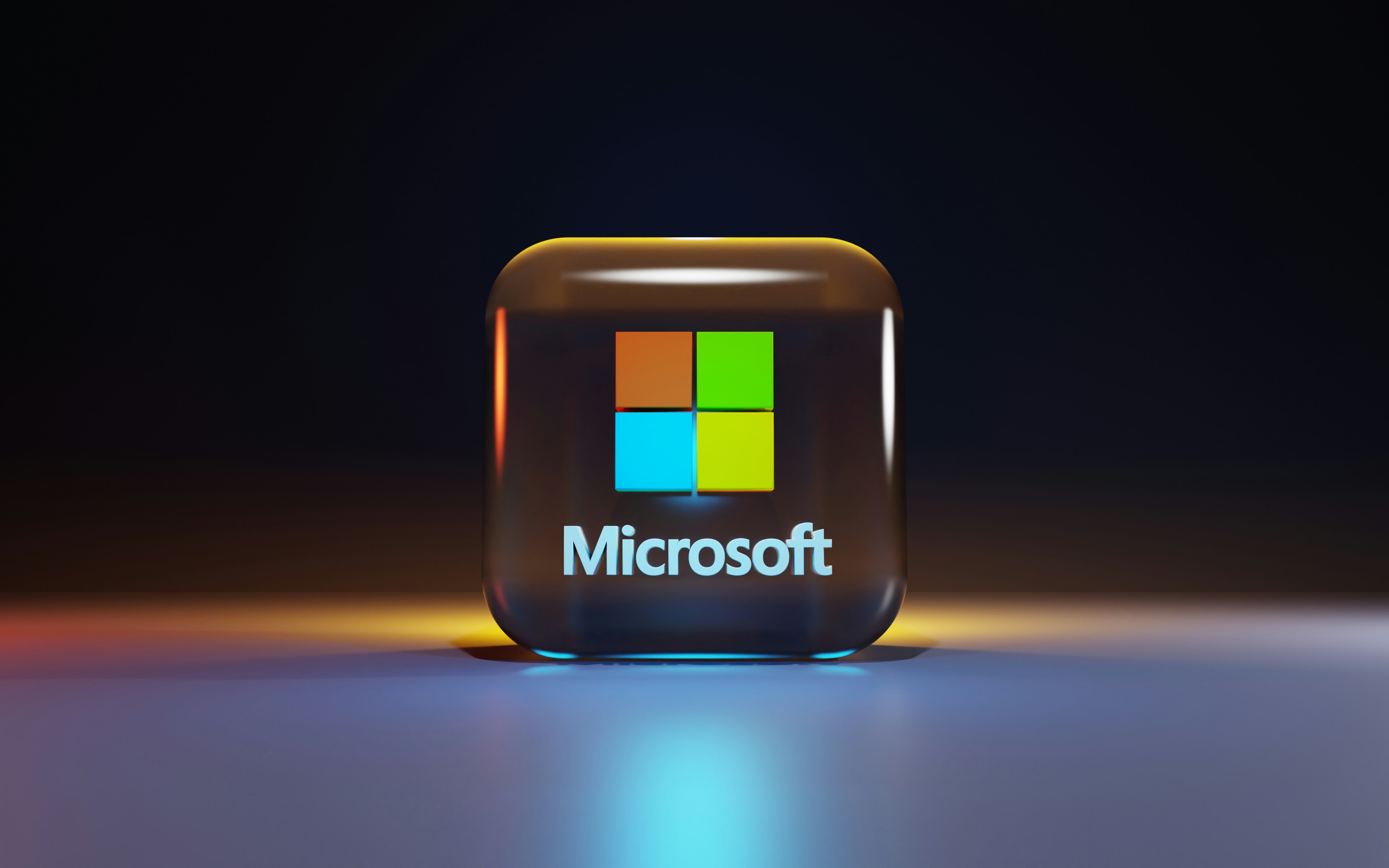 The Microsoft logo rendered as a glossy three-dimensional tile.